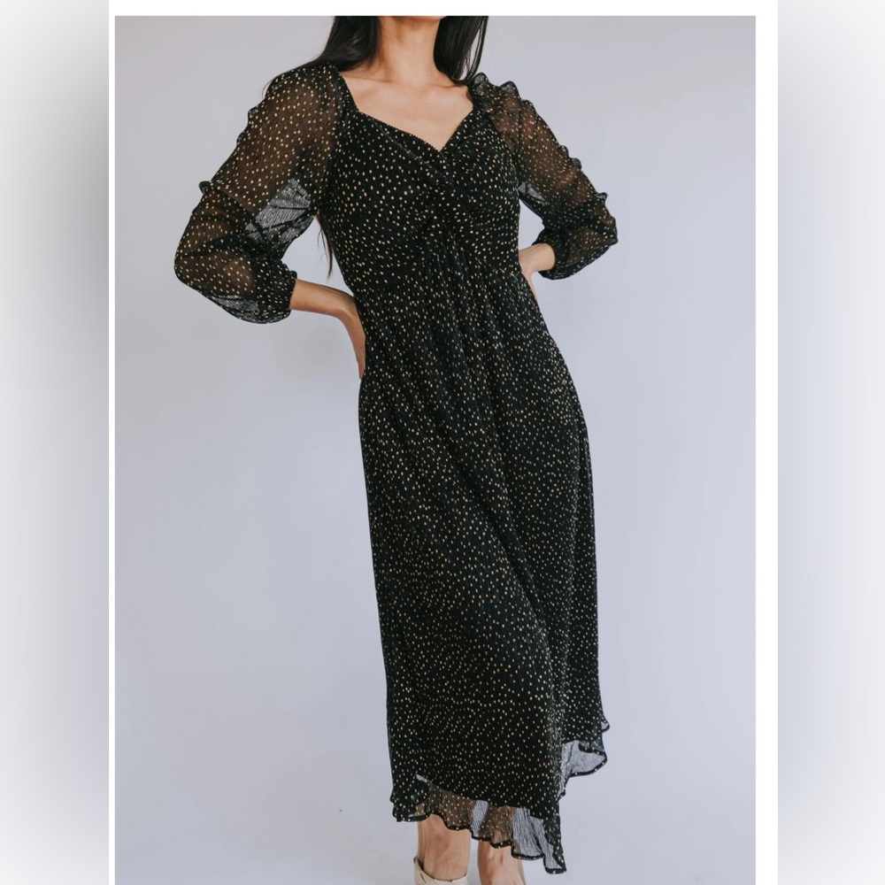 Shimmery black and gold midi dress, perfect for the holidays! Sheer arm detail.